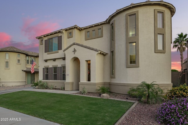 5628 N Rattler Way, Litchfield Park, AZ 85340 - view of front of house with stucco siding and a front lawn