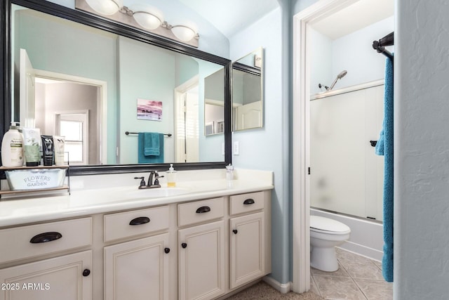 5628 N Rattler Way, Litchfield Park, AZ 85340 - bathroom featuring toilet, vanity, and bath / shower combo with glass door