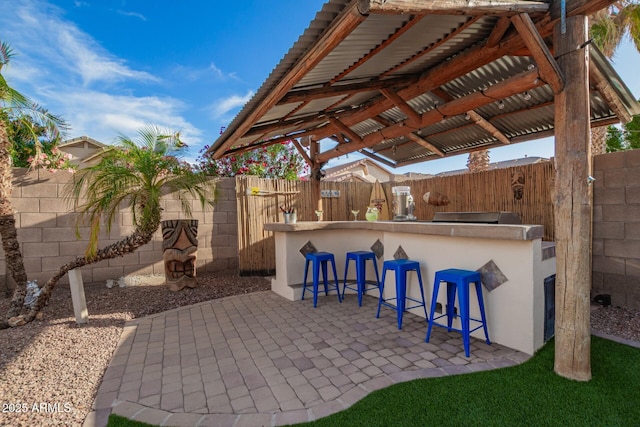 5628 N Rattler Way, Litchfield Park, AZ 85340 - fenced backyard with a patio area
