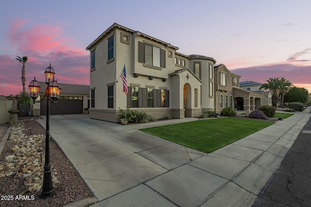 5628 N Rattler Way, Litchfield Park, AZ 85340 - mediterranean / spanish-style house with stucco siding, a garage, an outdoor structure, driveway, and a front lawn