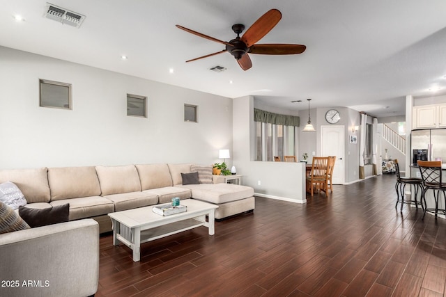 5628 N Rattler Way, Litchfield Park, AZ 85340 - living room with a ceiling fan, dark wood-type flooring, recessed lighting, stairway, and baseboards