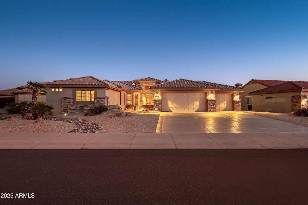 mediterranean / spanish-style house featuring a garage