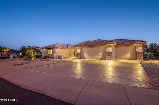 mediterranean / spanish-style home with a garage