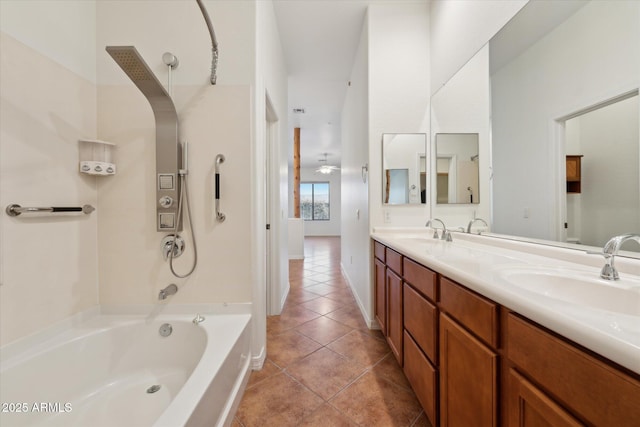 full bathroom featuring double vanity, tile patterned floors, and a sink