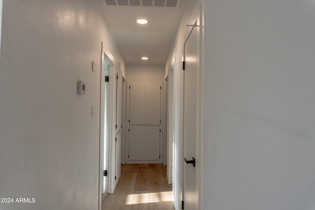 hallway featuring light hardwood / wood-style flooring