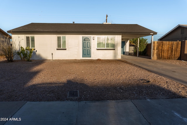 ranch-style home with a carport