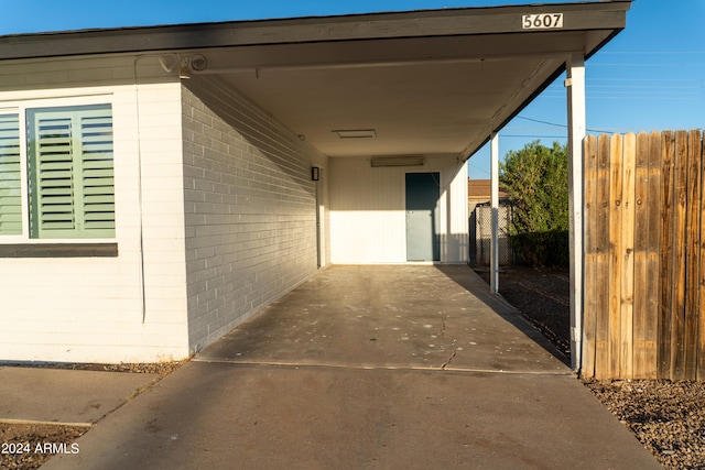 view of exterior entry featuring a carport