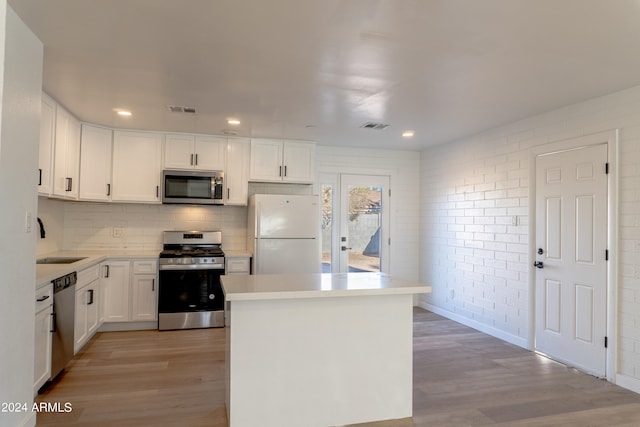 kitchen featuring white cabinetry, light hardwood / wood-style floors, stainless steel appliances, and sink