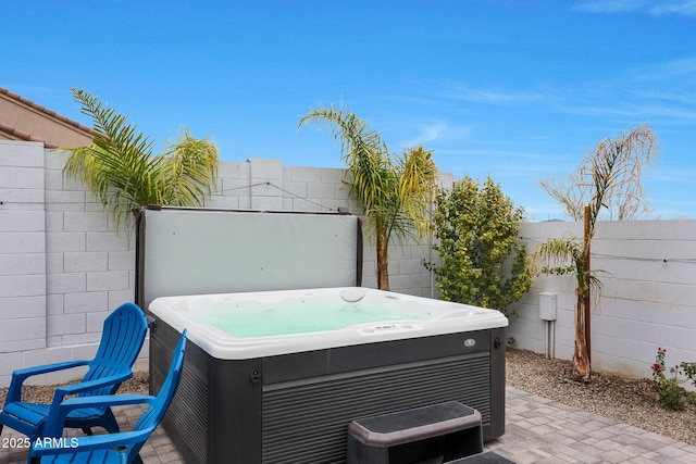 view of patio / terrace featuring a hot tub