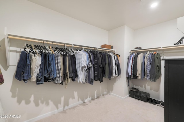 walk in closet with carpet