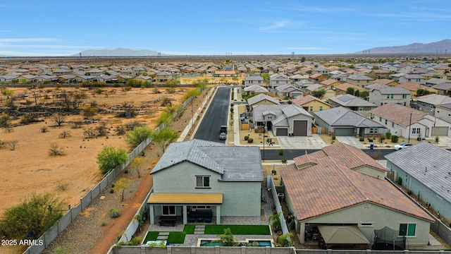 drone / aerial view with a residential view and a mountain view