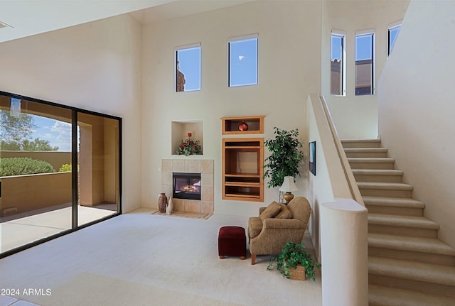 interior space featuring a fireplace and a high ceiling