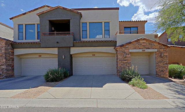 view of front of house with a balcony and a garage