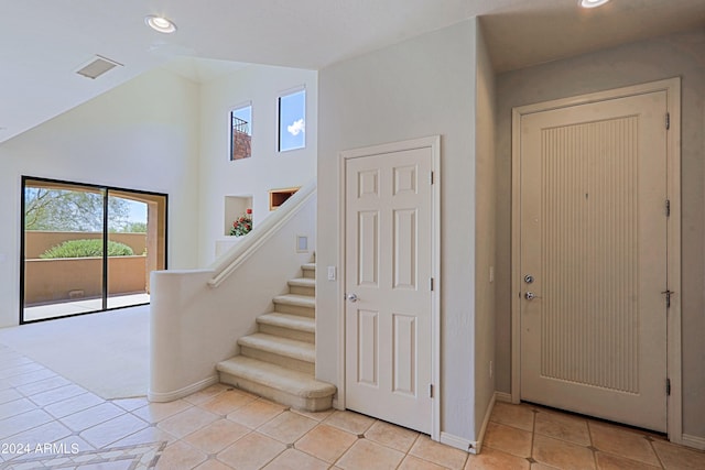 stairway featuring tile patterned flooring