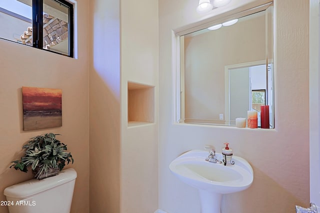 bathroom with sink and toilet