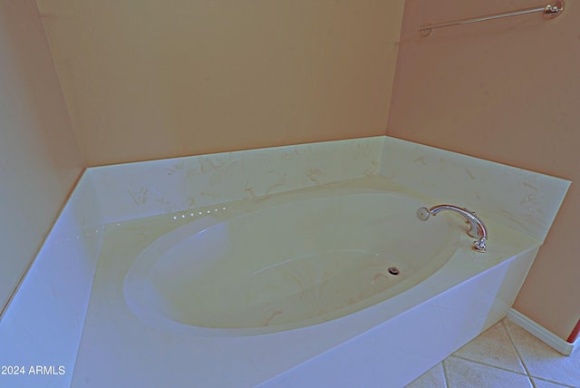 bathroom featuring tile patterned flooring and a washtub