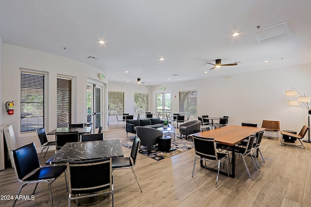 dining area featuring ceiling fan and light wood-type flooring