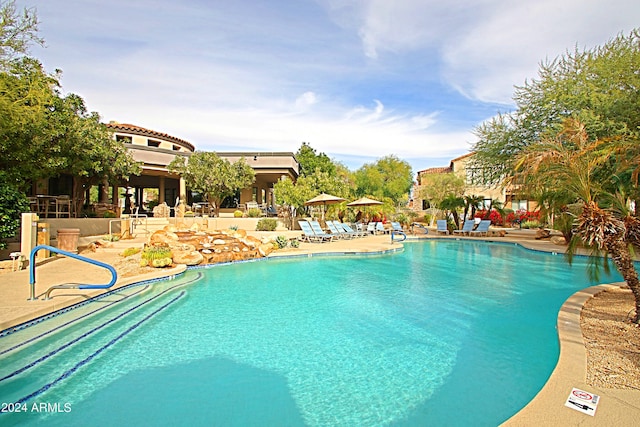 view of swimming pool with a patio area