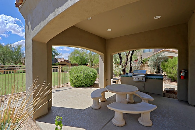 view of patio with grilling area and exterior kitchen