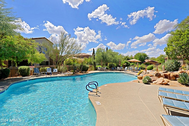 view of swimming pool featuring a patio