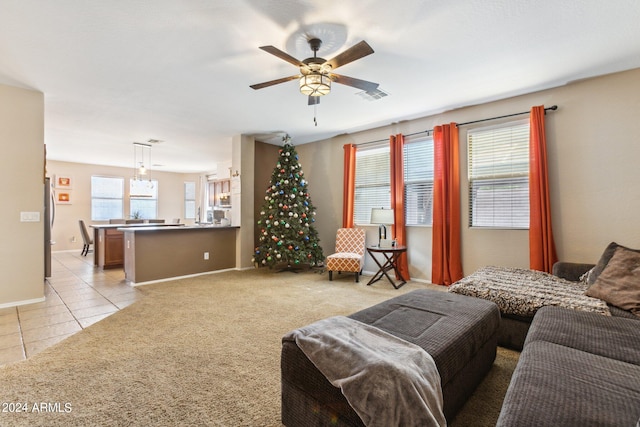 tiled bedroom with stainless steel refrigerator and ceiling fan