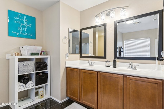 bathroom featuring tile patterned flooring and vanity