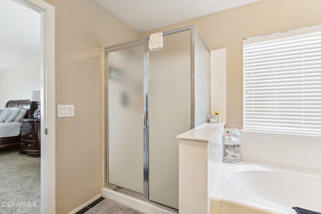 bathroom with independent shower and bath