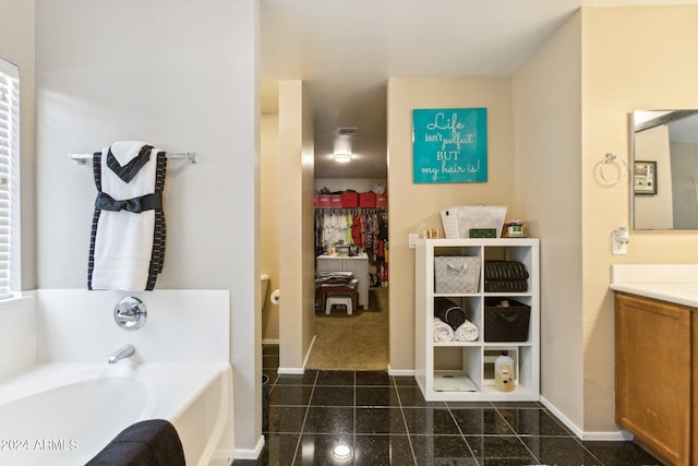 bathroom with a bath and vanity