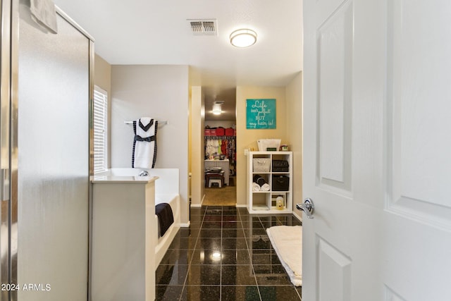 bathroom featuring independent shower and bath