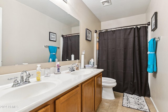 bathroom with walk in shower, vanity, tile patterned flooring, and toilet