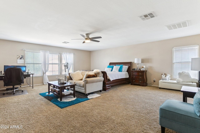 carpeted bedroom with ceiling fan