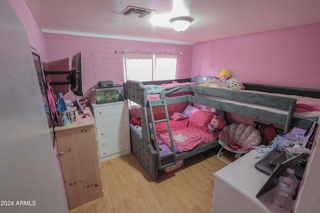 bedroom with light wood-type flooring