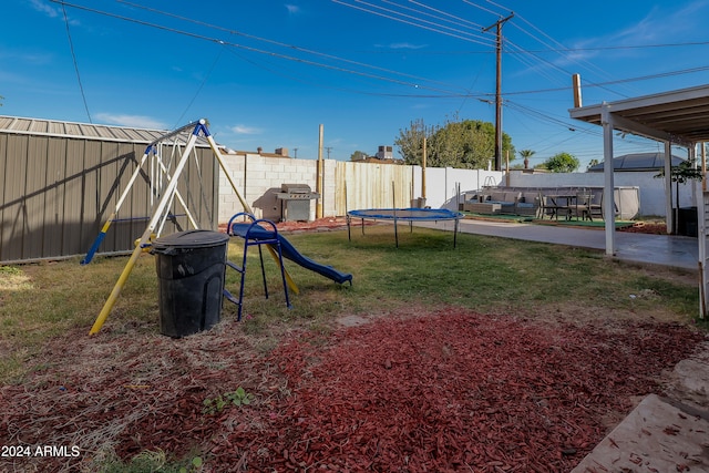 view of yard with a patio area and a trampoline