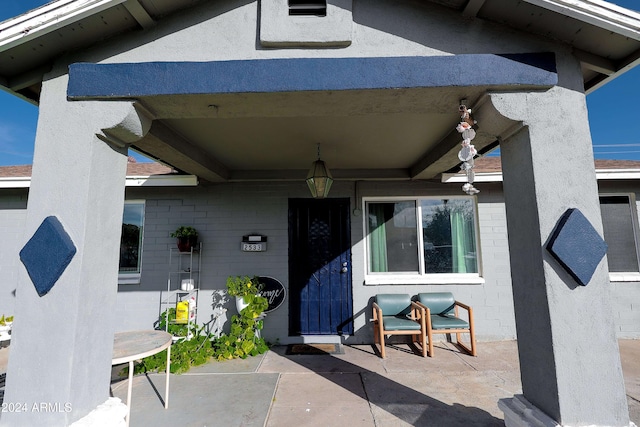 property entrance with a patio