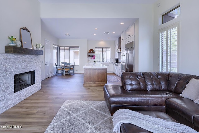 living room with hardwood / wood-style flooring and a healthy amount of sunlight