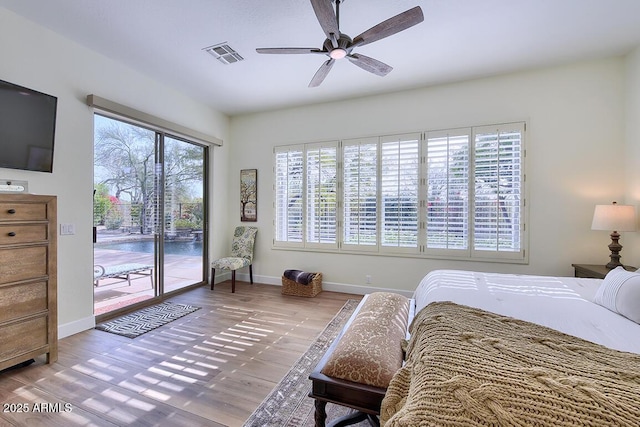 bedroom featuring ceiling fan, hardwood / wood-style floors, and access to outside