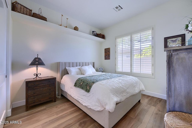 bedroom featuring light wood-type flooring