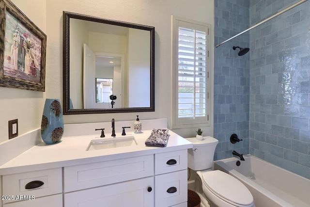 full bathroom featuring vanity, toilet, and tiled shower / bath