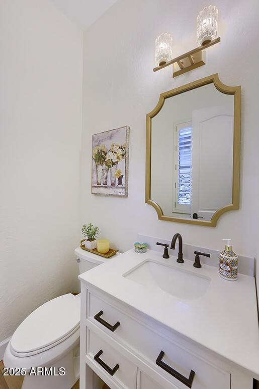 bathroom with vanity and toilet