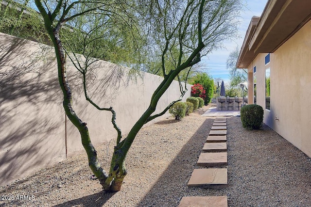 view of yard featuring a bar and a patio area