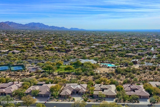 birds eye view of property with a mountain view