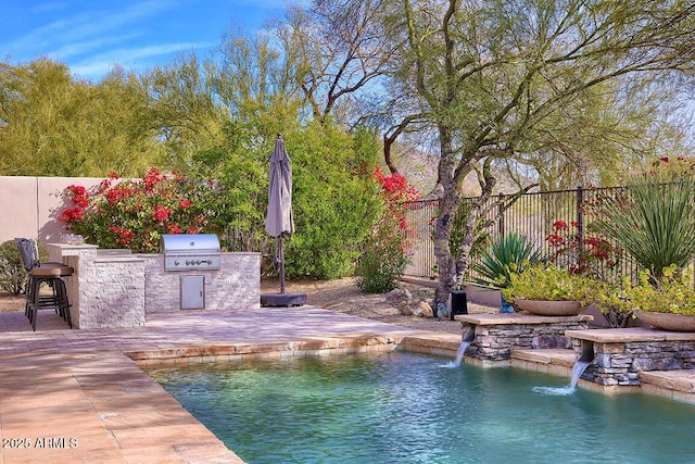 view of pool featuring a patio area, area for grilling, grilling area, a bar, and pool water feature