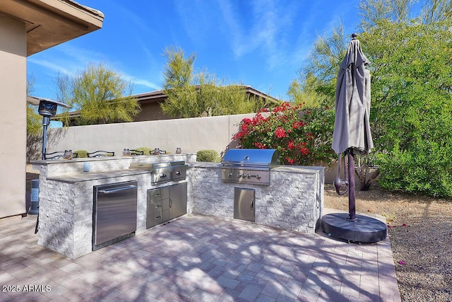 view of patio / terrace featuring an outdoor kitchen and area for grilling