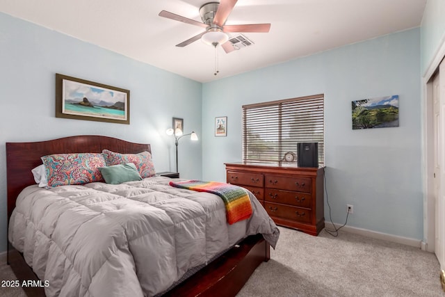 bedroom featuring a ceiling fan, light colored carpet, visible vents, and baseboards