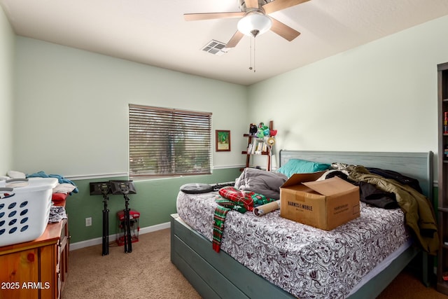 carpeted bedroom featuring visible vents, baseboards, and a ceiling fan