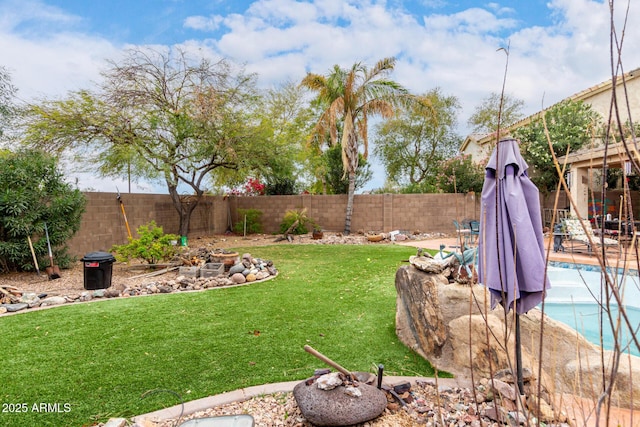 view of yard with a fenced backyard