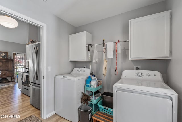19930 N 98th Ave, Peoria, AZ 85382 - laundry room with cabinet space, washer and clothes dryer, and light wood finished floors
