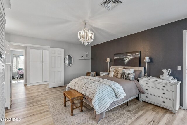 19930 N 98th Ave, Peoria, AZ 85382 - bedroom with a chandelier and light wood-type flooring