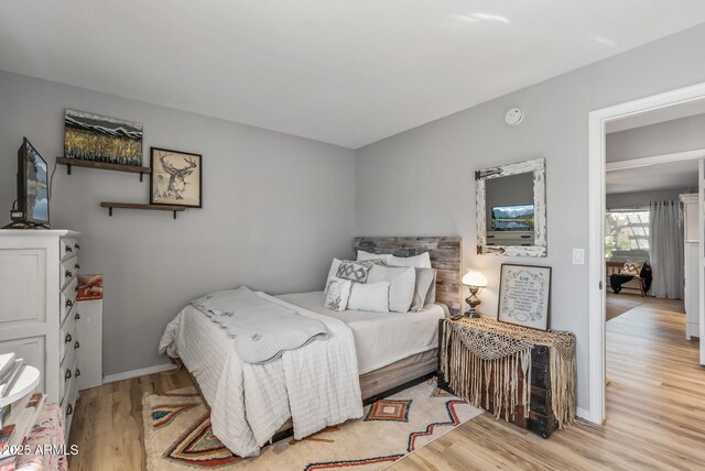 19930 N 98th Ave, Peoria, AZ 85382 - bedroom featuring wood finished floors and baseboards