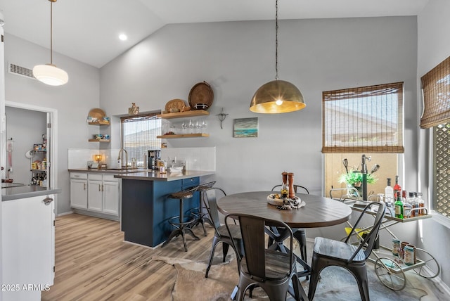 19930 N 98th Ave, Peoria, AZ 85382 - dining area featuring high vaulted ceiling and light wood-type flooring